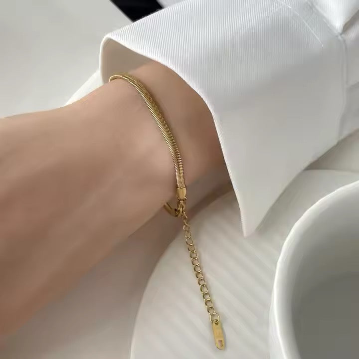 Dainty charm bracelet on wrist — Kimoore